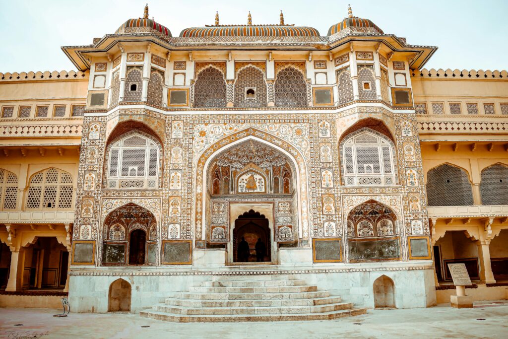 Ornate entrance of Amber Fort showcasing intricate architectural design and craftsmanship.